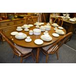 An Ercol dining room suite, comprising oval table,