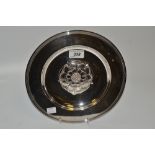 An Elizabeth II silver dish , central cast rose, plain boarder,