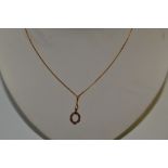 A 9ct gold and ruby pendant necklace, 2.