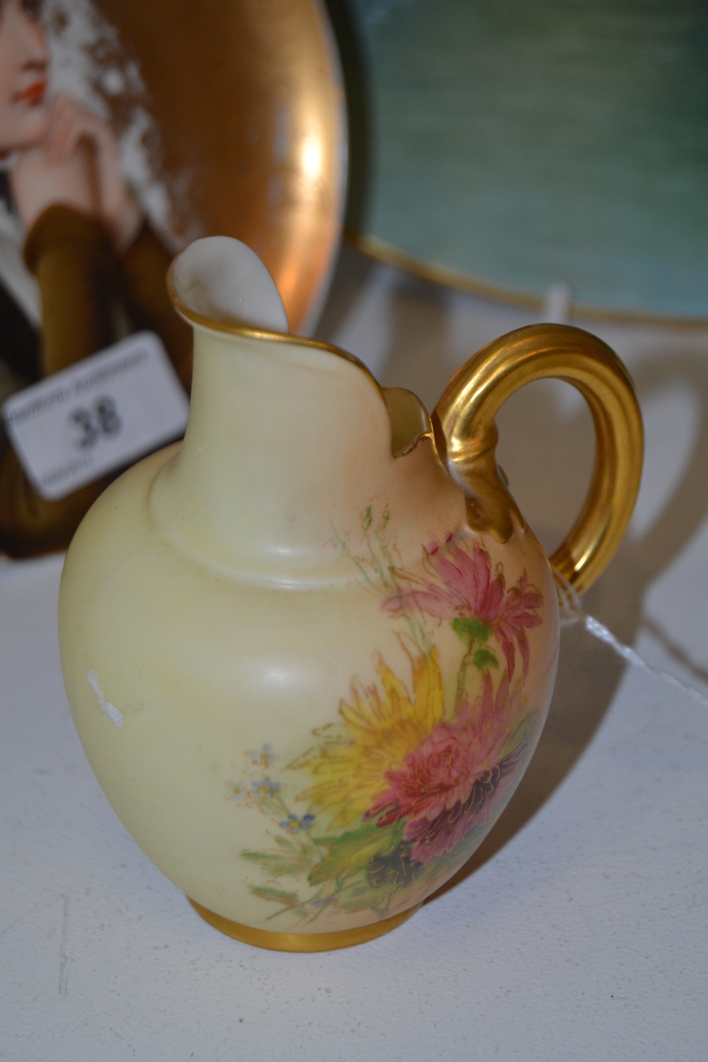 A Royal Worcester flat sided ovoid jug,