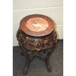 A Chinese hardwood stand, circular top set with rouge marble panel, deep sides,