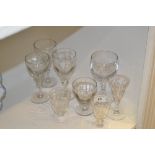 Glass - a set of three moulded bowl wine glasses;  a fluted bowl wine glass,