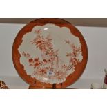 A Chinese circular charger, painted with finches on a blossoming branch,