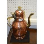 A French copper and brass baluster water vessel, dragon spout,