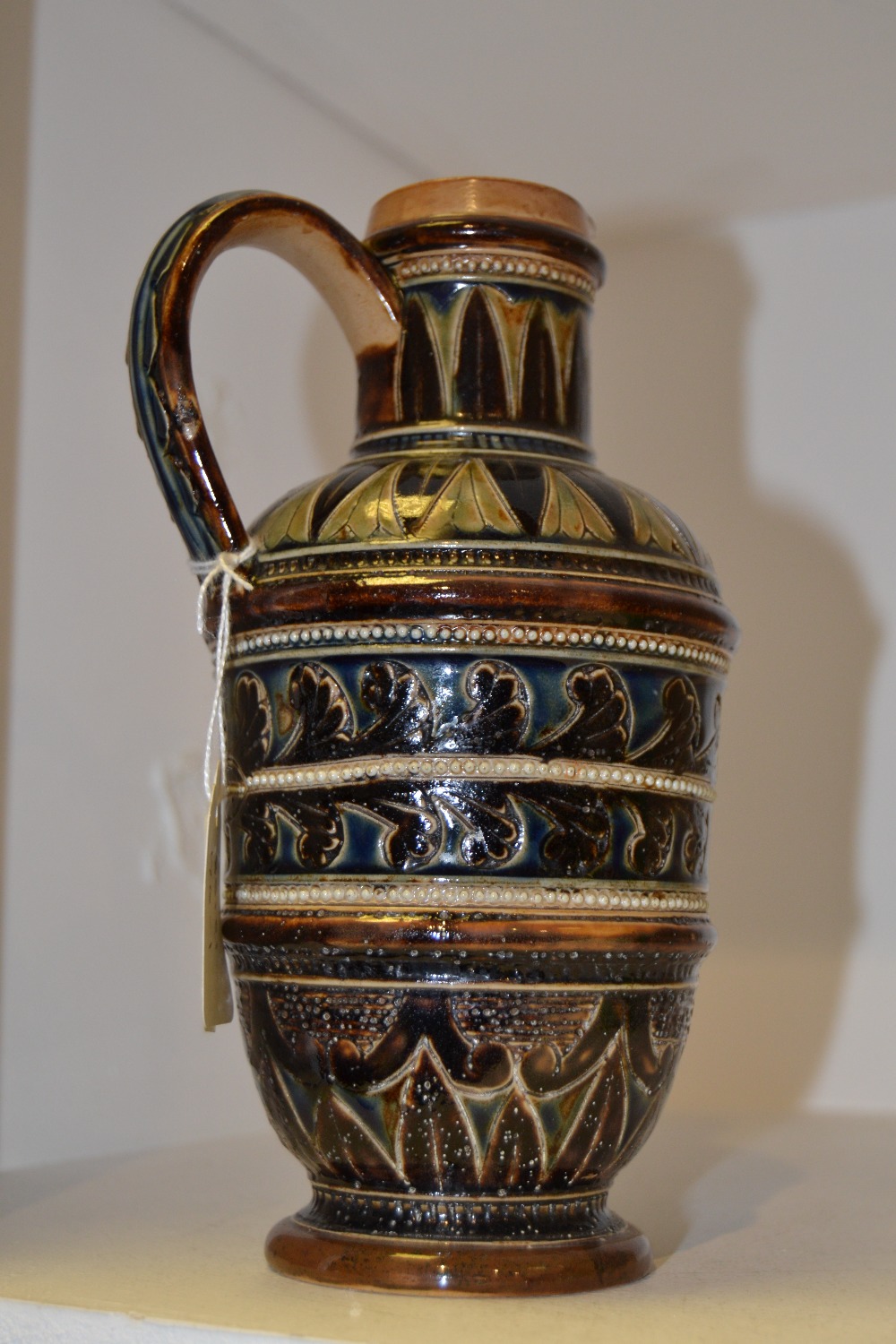 A Doulton Lambeth ewer, designed by Florence E.