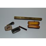 An Edwardian 9ct gold mounted amber cigar holder, hallmarked,