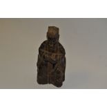 A carved treen figure of a religious dignitary,