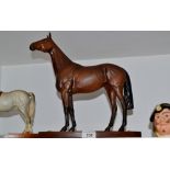 A Beswick model, Red Rum, hardwood stand with plaque, 32.