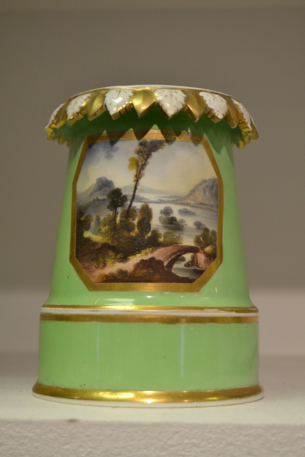 A Bloor Derby Named View spreading cylindrical vase/night light, painted with a View in Cumberland,