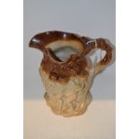 A late 19th century London  brown salt glazed stoneware Silenus jug,