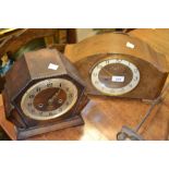 A 1950's walnut mantel clock, Arabic numerals;  another, oak,