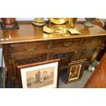 Frank Pratt of Derby - an oak side cabinet, moulded edge above three raised and fielded drawers,