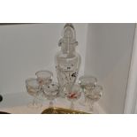 A 1950's cocktail set comprising of a decanter  and six glasses,