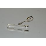 A silver caddy spoon;