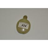 A Chinese flattened oval jade snuff bottle,