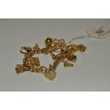 A 9ct gold charm bracelet, eleven various charms, 44.