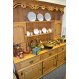 A contemporary blonde oak Welsh dresser , dentil cornice, spice cupboards,