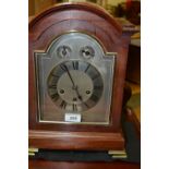 An early 20th century mahogany mantel clock, eight day movement striking on a gong,
