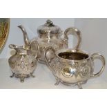 A Victorian silver-plated three-piece tea set, comprising melon-shaped teapot with ceramic ferrules,