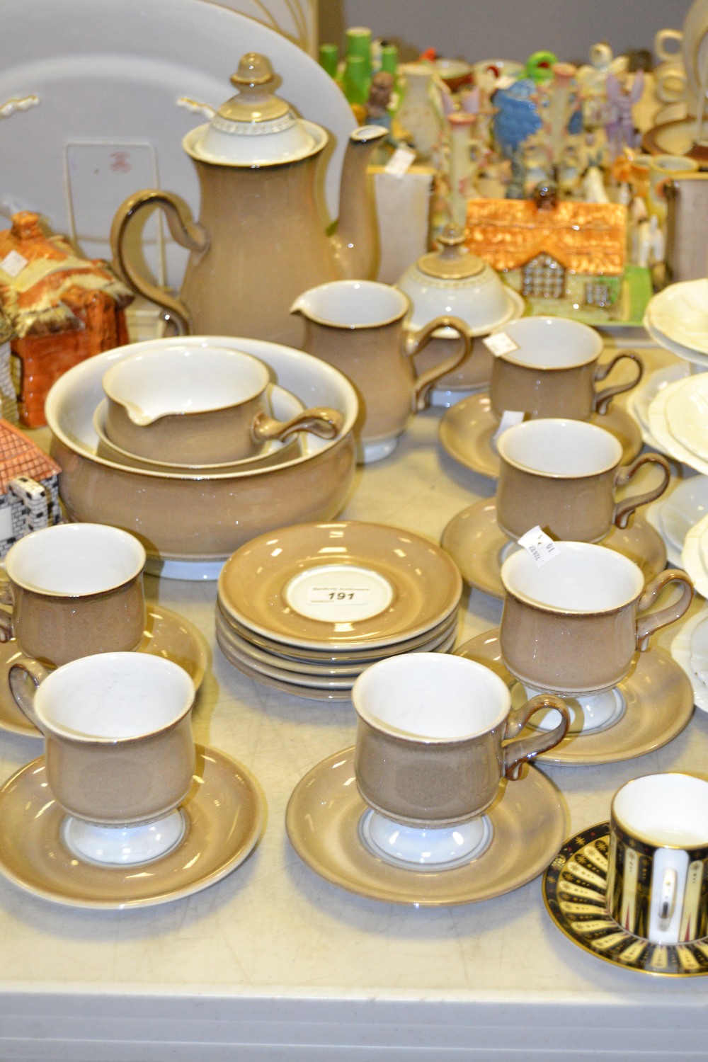 A Denby six setting coffee service, comprising coffee pot, cream jug, covered sucrier,