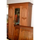 A early 20h century Arts and Crafts style single door wardrobe, c.