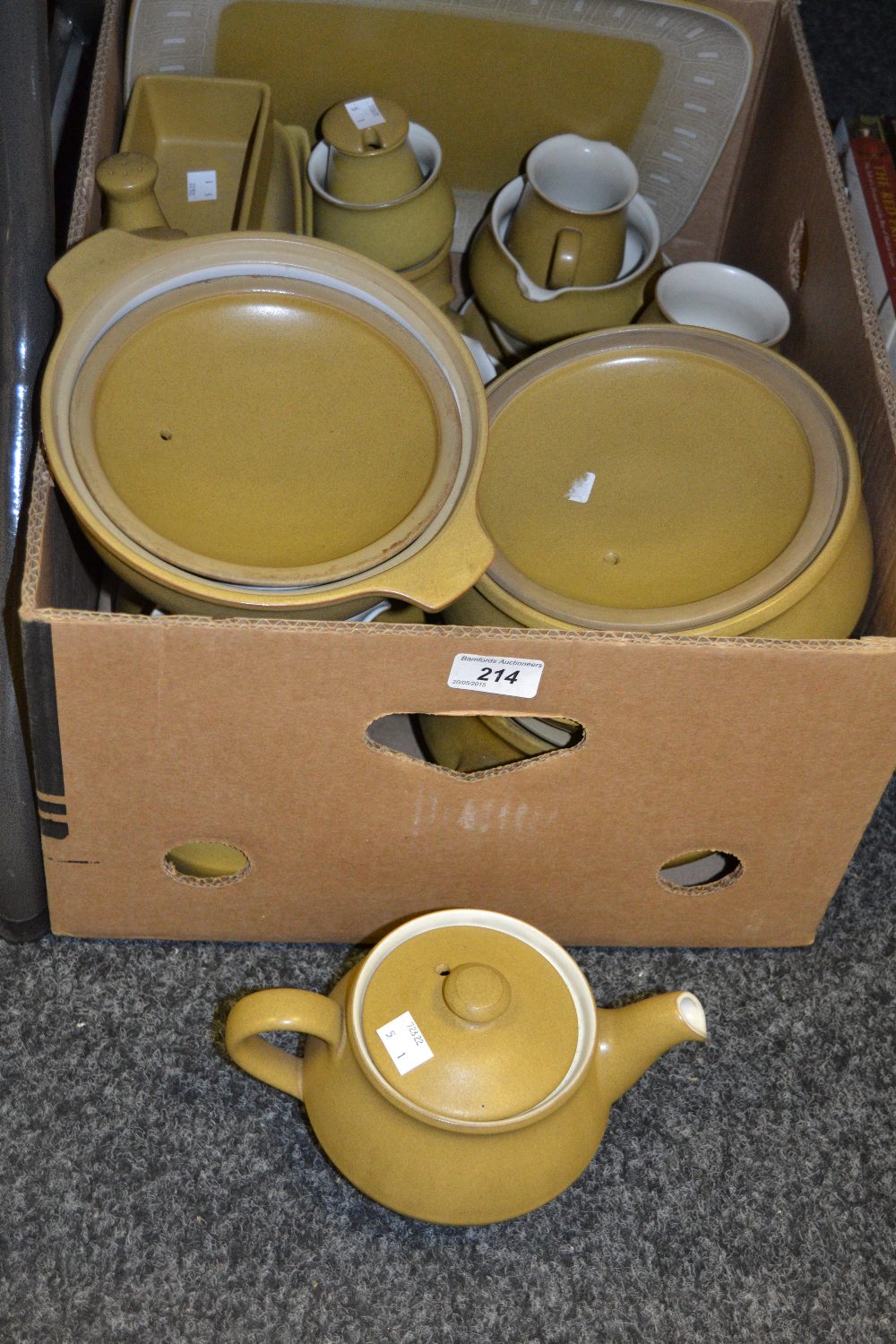 A Denby tea and part dinner service, mustard ground, comprising teacups and saucers, teapot,