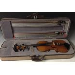A German full-size violin, two-piece back 36cm long excluding button, ebonised tuning pegs,