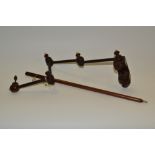 A George III mahogany adjustable articulated sewing clamp, turned ivory finials, 54cm long overall,