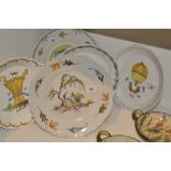 A set of three French earthenware plates,