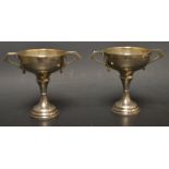 A pair of silver trophy cups,