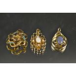 A 9ct gold pendant set with a central opal and seed pearls; another, with central fire opal,