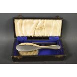 A child's silver brush and comb set, cased,