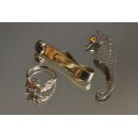 A silver novelty seahorse brooch, Birmingham 1989; a silver fox head ring; a silver tie clip,