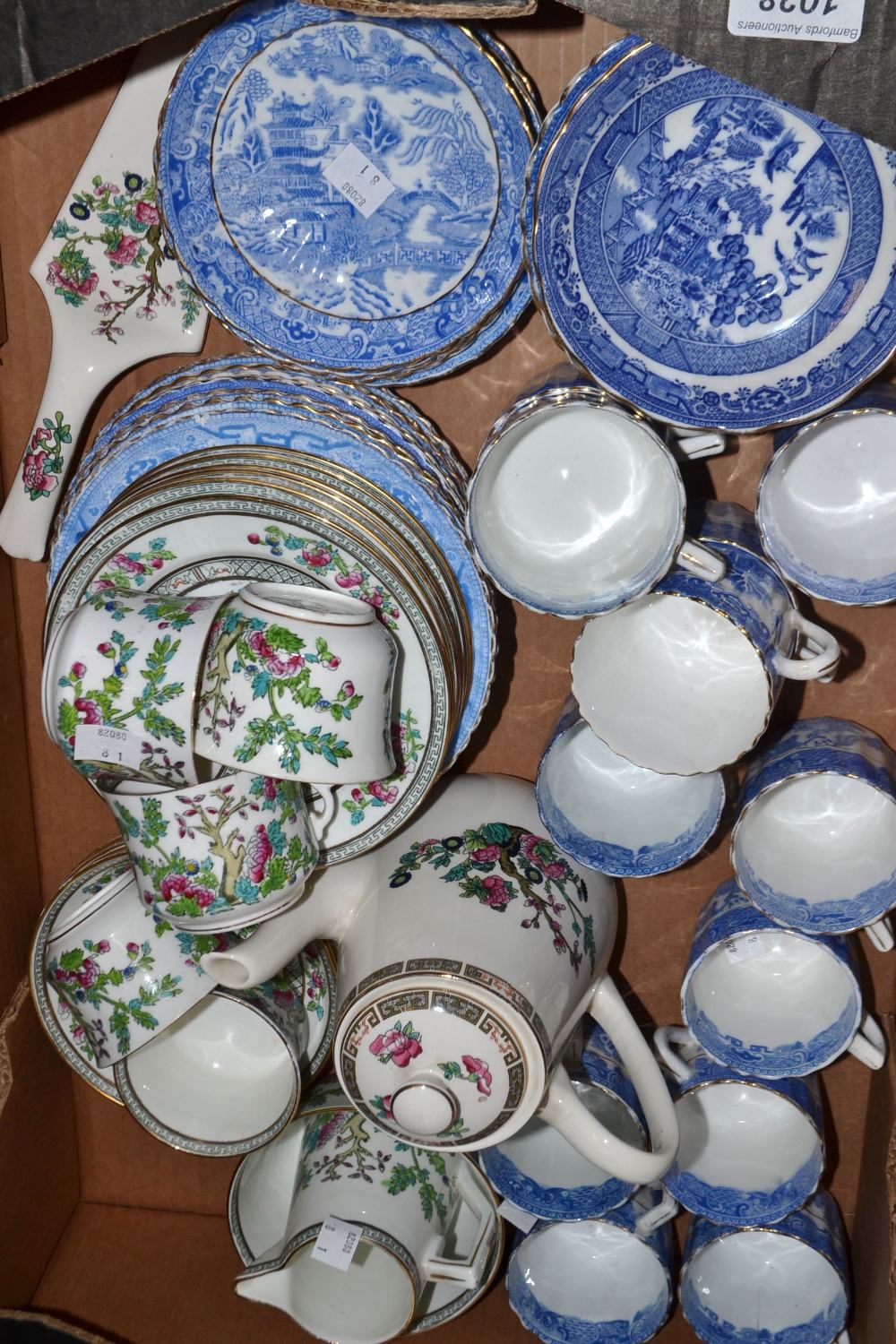 Table China- a matched Willow pattern blue and white table service including cups, saucers,