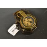 A leather cased military compass by Short and Mason, No.