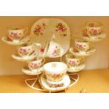 A Stanley China tea set, printed with colourful summer flowers comprising six tea cups,