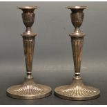 A pair of Roberts and Belk silver candlesticks