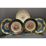 A pair of Limoges plates decorated in gilt and teal; a pair of Limoge plates;