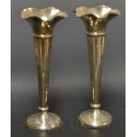 A pair of silver Walker and Hall vases, 24cm high,