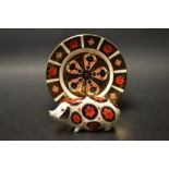 A Royal Crown Derby paperweight, Pig, gold stopper;  a Royal Crown Derby side plate, 1128 Old Imari,