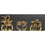 Jewellery - a cabochon moonstone three stone scrolling dress ring,