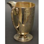 A silver pedestal cream jug,