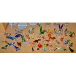 A miniature glass handmade model of a dolphin; others some larger, rabbit, angel fish, pelican,