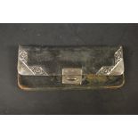 An early 20th century silver mounted leather purse,