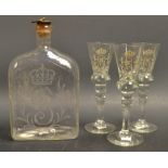 A George III style Stourbridge type glass rectangular decanter and a set of three conforming