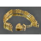 A 9ct gold gate link bracelet, love heart clasp, 13.
