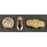 A silver thimble; a floral brooch;