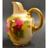 A Royal Worcester globular jug painted with roses,