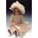 A Simon & Halbig for Kammer & Reindhart bisque head doll, blue weighted eyes,