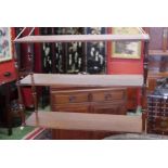 A Victorian Campaign mahogany three-tier collapsible hanging book shelf,